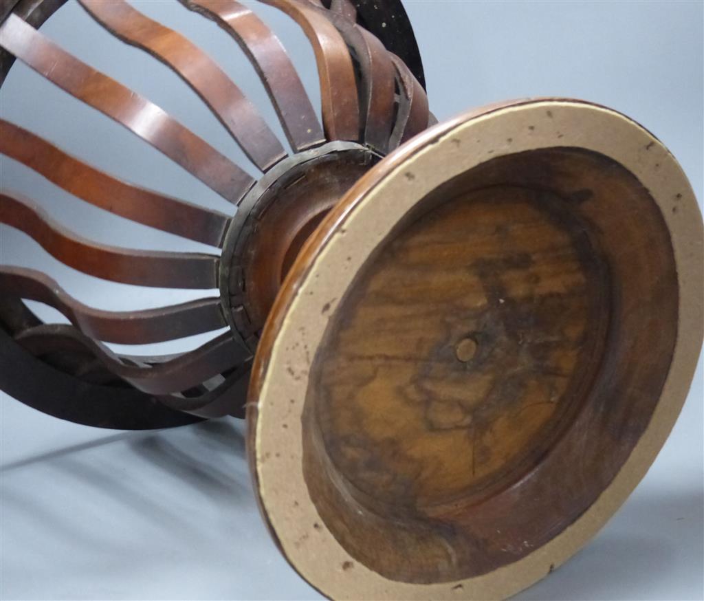 An early 20th century Dutch walnut jardiniere, lacking brass liner